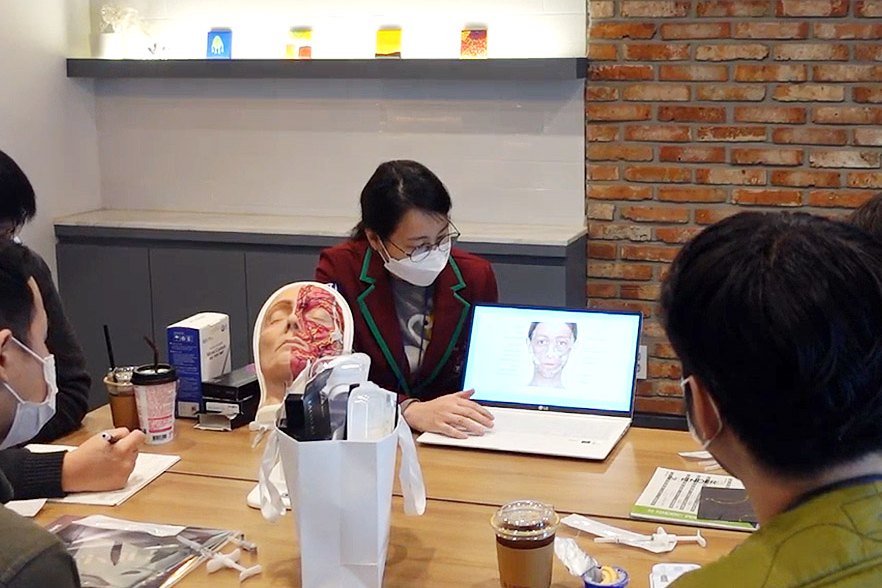 Dr. Yoon leading a hands-on training session for physicians
